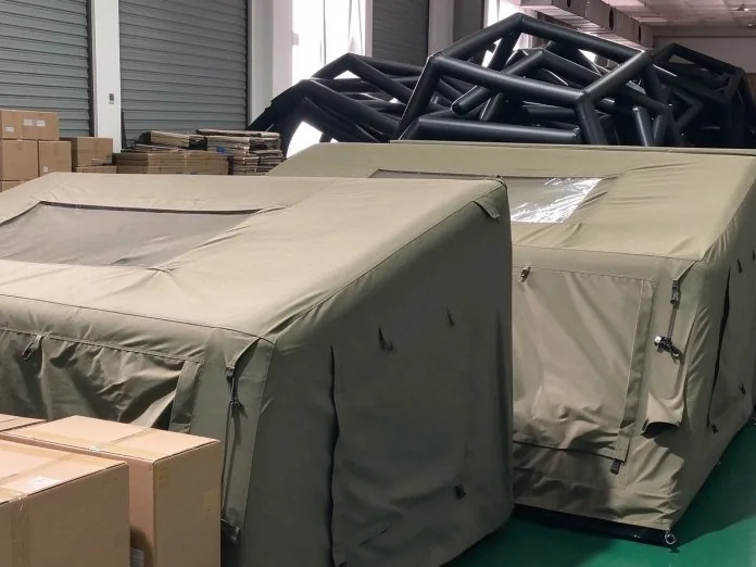 Finished tents staged in the workshop before packing and dispatch