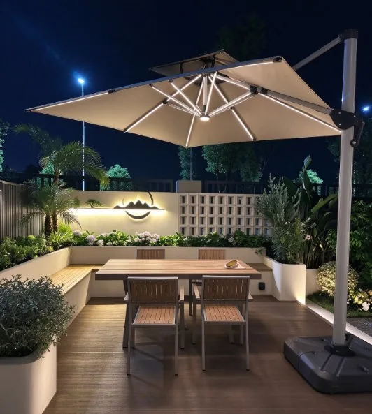 Cantilever umbrella over a dining table at night