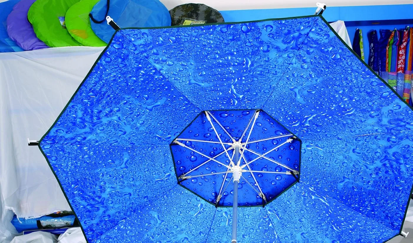 Vented golf umbrella canopy seen from below, showing the double-tier wind vent